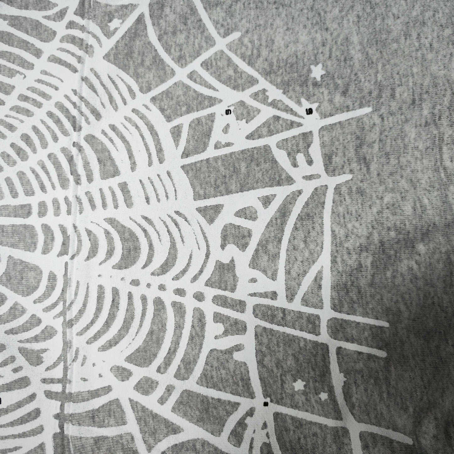 Full front artwork on Sp5der OG Web Hoodie Heather Grey with white puff logo and spider web
Full front artwork on Sp5der OG Web Hoodie Heather Grey with white puff logo and spider web
Side angle showing the three-dimensional white puff-print texture on Sp5der OG Web Hoodie
Close-up of white spider-web artwork on the front of Sp5der OG Web Hoodie Heather Grey