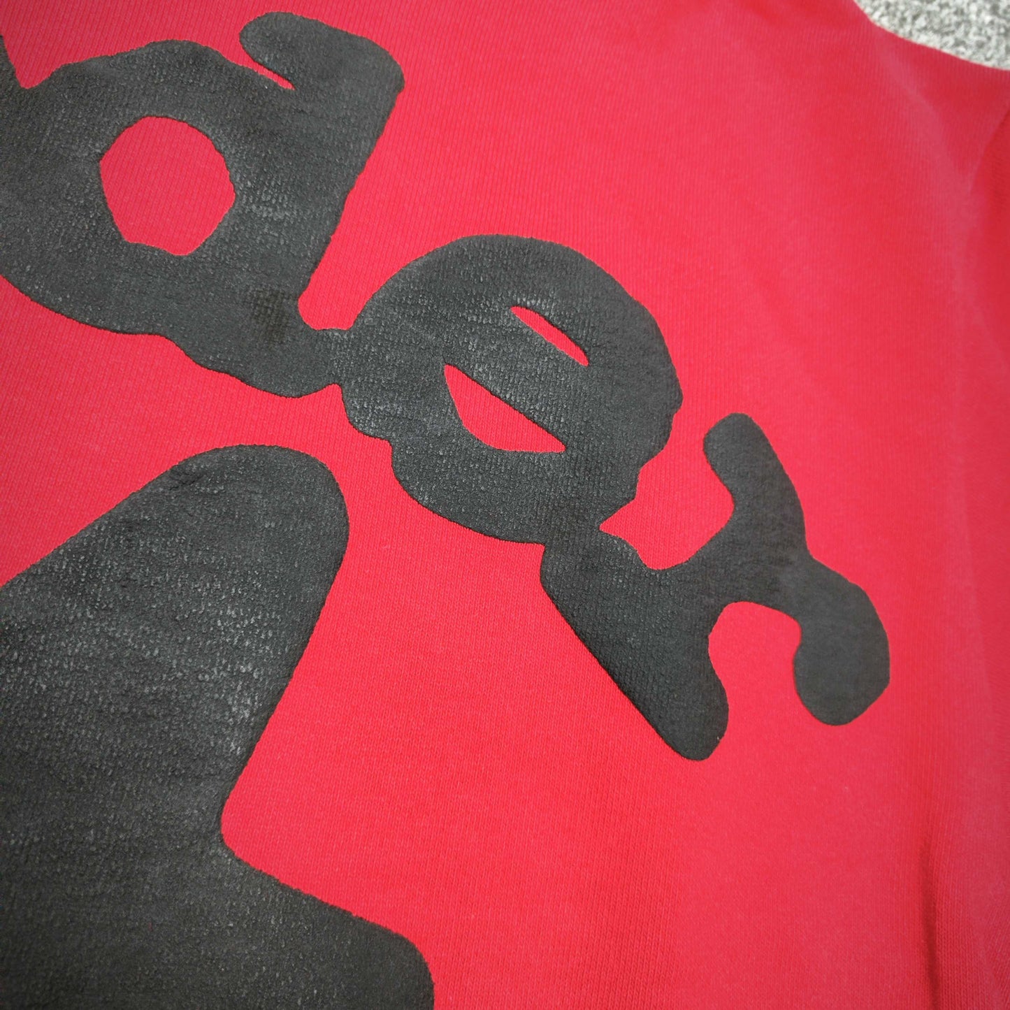 Full black puff-print artwork on Sp5der Beluga Hoodie Red Black with logo, stars and number graphics
Full black puff-print artwork on Sp5der Beluga Hoodie Red Black with logo, stars and number graphics
Full black puff-print artwork on Sp5der Beluga Hoodie Red Black with logo, stars and number graphics
Black star and number graphics printed across the sleeve of Sp5der Beluga Hoodie Red Black