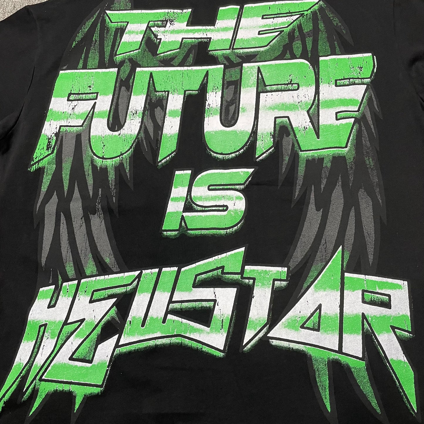 Full back graphic artwork on the black Hellstar The Future T-Shirt
Hellstar logo graphic printed across the upper back of The Future T-Shirt
The Future Is Hellstar slogan printed across the lower back of the black T-shirt