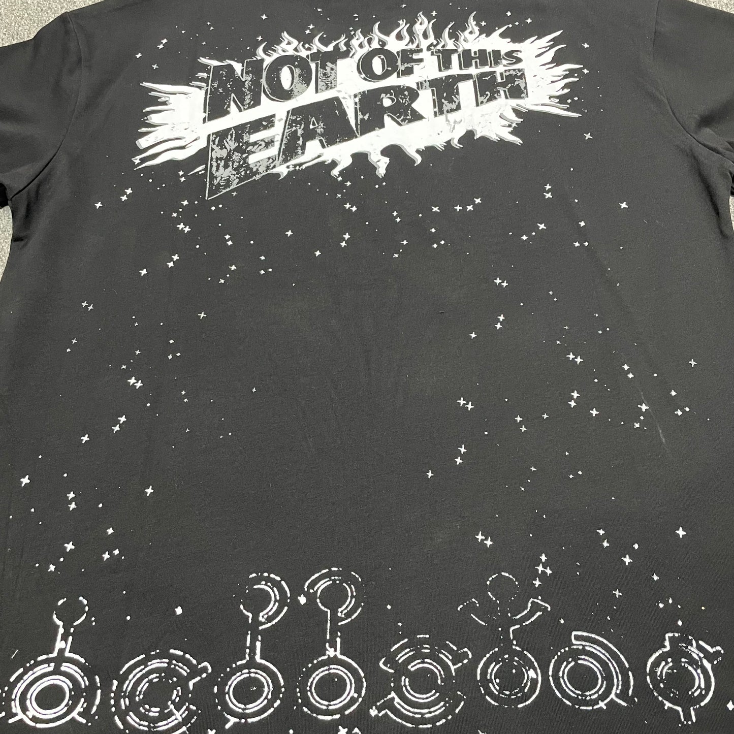 Full rear graphic artwork on the black Hellstar Not of This Earth T-Shirt
Rear slogan lettering detail on the Hellstar Not of This Earth black T-shirt
Close-up of the back graphic print on the Hellstar Not of This Earth T-Shirt