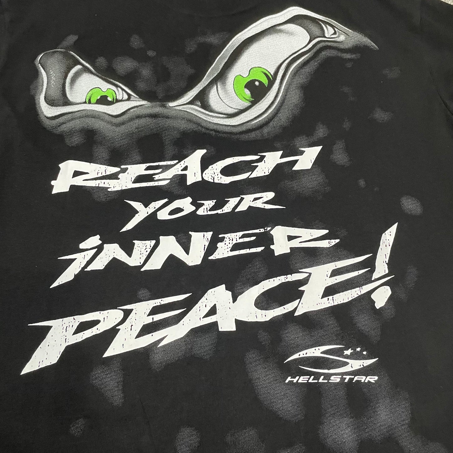 Full rear yoga-inspired graphic artwork on the Hellstar Reach Your Inner Peace Om T-Shirt
Close-up of the back graphic print on the Hellstar Reach Your Inner Peace T-Shirt
Reach Your Inner Peace lettering detail on the back of the Hellstar yoga T-shirt