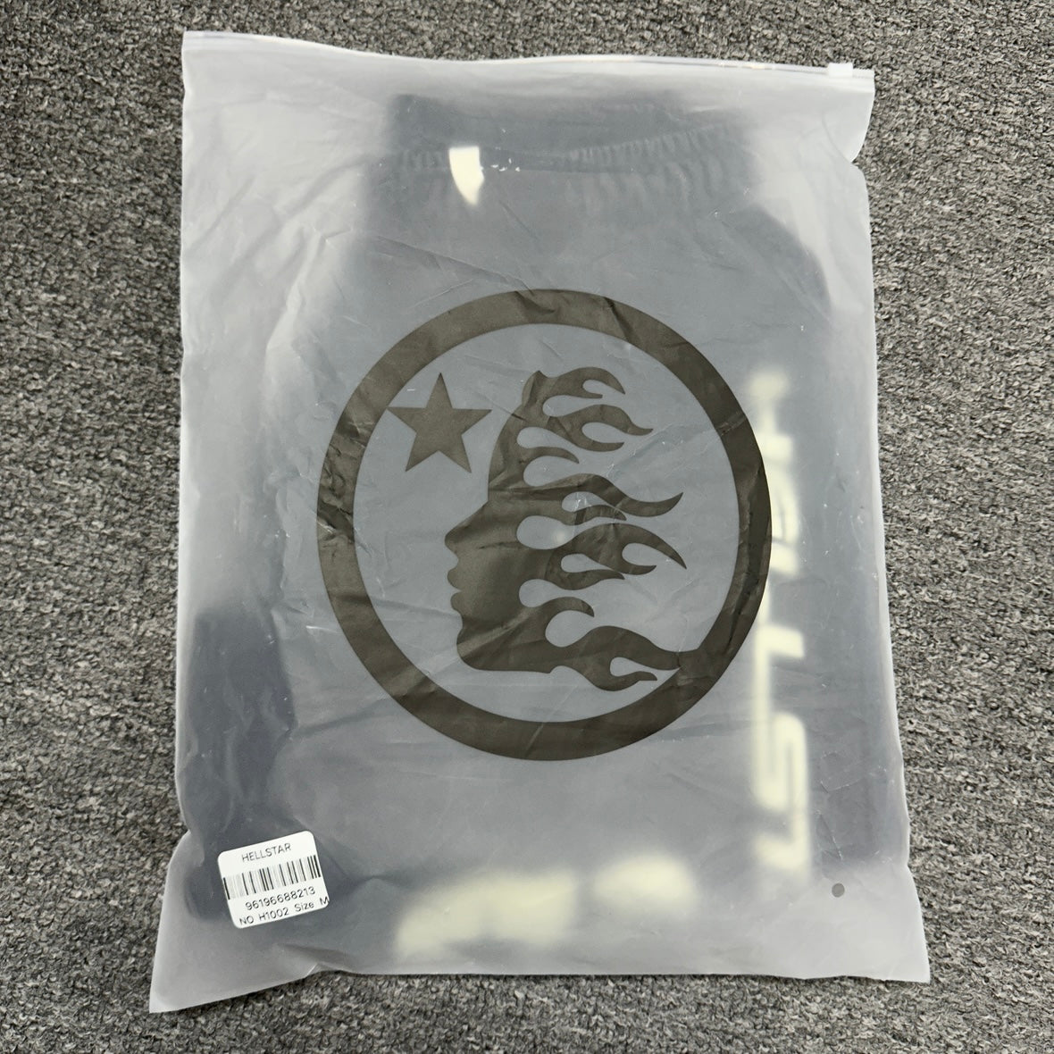 Hellstar Vertical Logo washed black shorts inside branded zip packaging