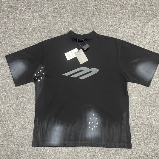 Black Balenciaga spray gradient tee with silver M logo, studs and hang tags