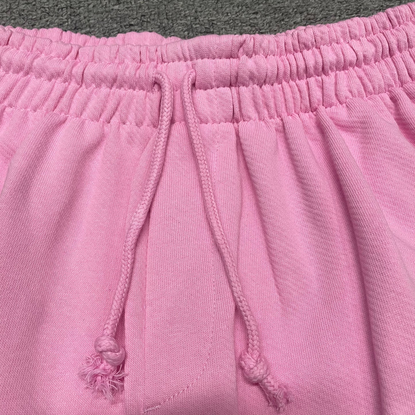 Powder Pink Cotton Wreath Sweatshorts with all-over white puff print
Close-up of white Cotton Wreath puff print on Powder Pink sweatshorts
Raised 3D Cotton Wreath puff print texture on Powder Pink sweatshorts
