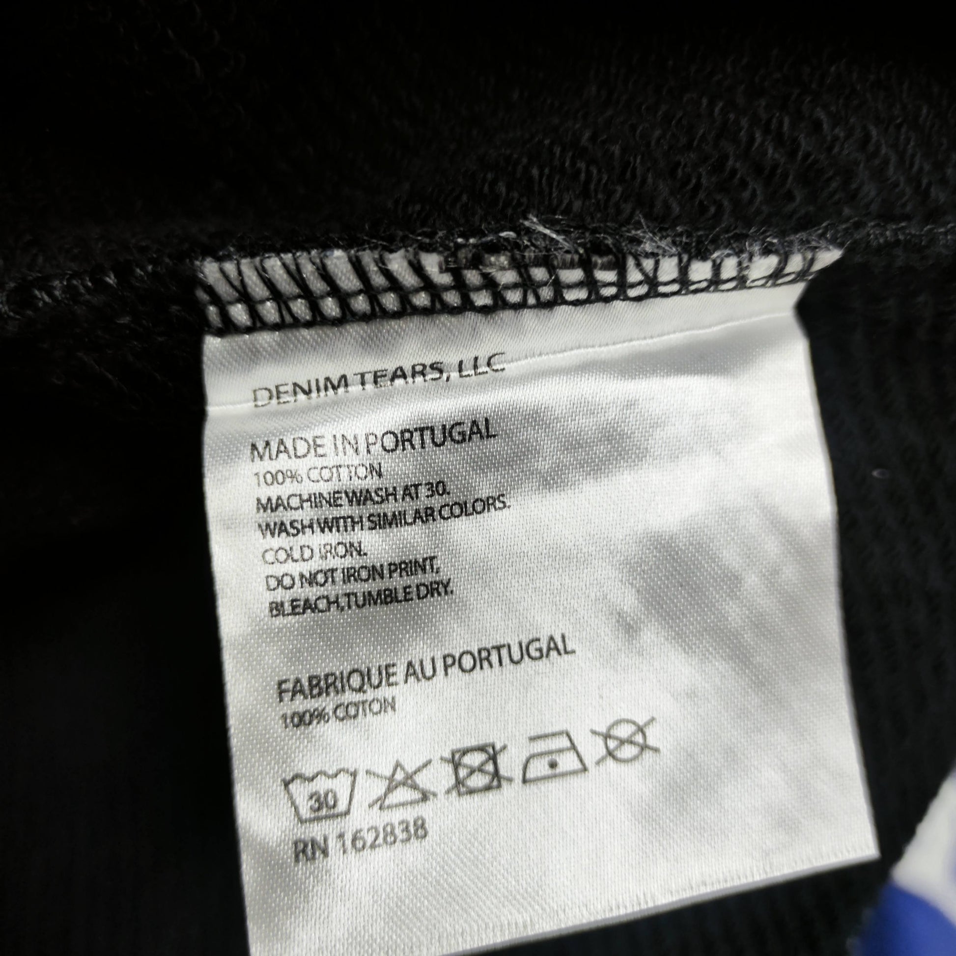 Denim Tears Cotton Wreath Hoodie Black neck label
Black Cotton Wreath Hoodie care label and fabric information