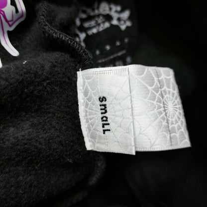 Sp5der P*NK sweatpants care label and washing instructions