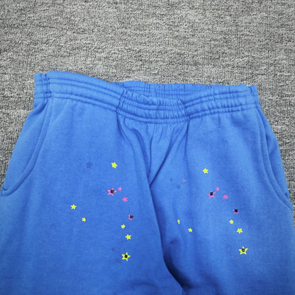 Multicolor star graphic details on SP5DER TC Blue sweatpants