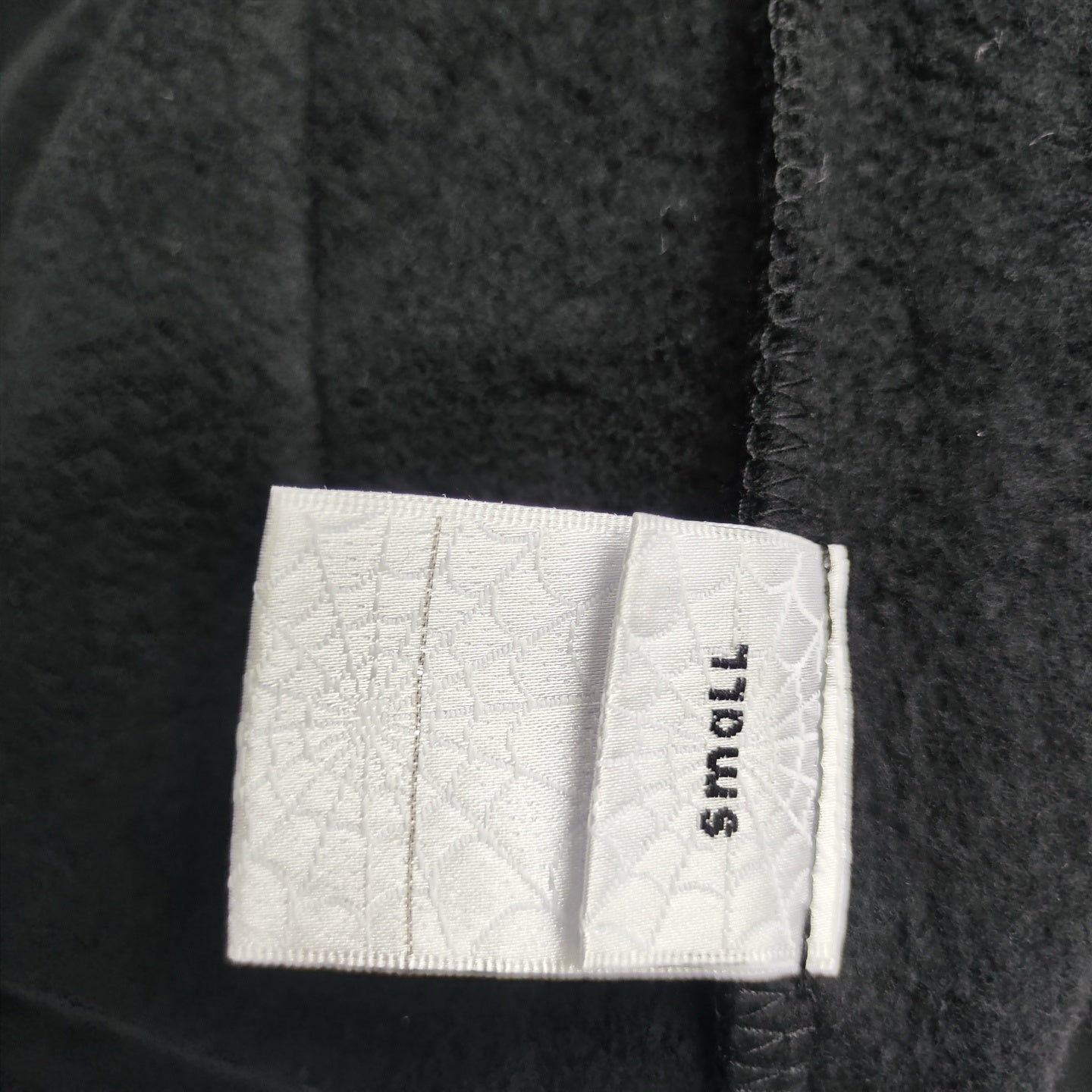 Sp5der P*nk Hoodie Black care label and washing instruction detail