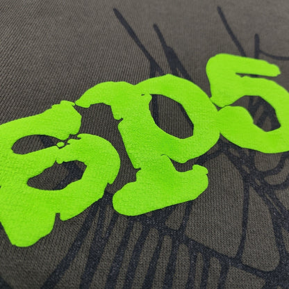 Full puff print artwork on Sp5der Wait Web Hoodie with green logo, dark web and scattered stars
Close-up of electric green puff print lettering on Sp5der Wait Web Hoodie Slate Grey
Side angle showing the raised three-dimensional puff print texture on Sp5der Slate Grey Hoodie