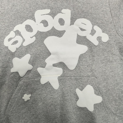 Full white puff-print artwork on Sp5der Beluga Hoodie Heather Grey with oversized logo and stars
Close-up of white puff-print lettering and star graphics on Sp5der Beluga Hoodie Heather Grey
Side angle showing the raised three-dimensional puff-print texture on Sp5der Beluga Hoodie