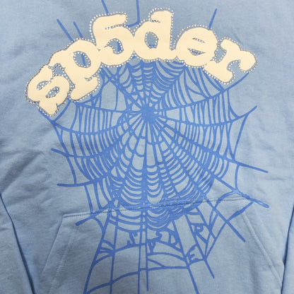 Full puff-print artwork on Sp5der Web Hoodie Sky Blue with white logo and signature blue spider web
Close-up of white puff-print Sp5der lettering and rhinestone edge details on Sky Blue Hoodie
Side angle showing the raised three-dimensional puff logo and rhinestone trim on Sp5der Sky Blue Hoodie