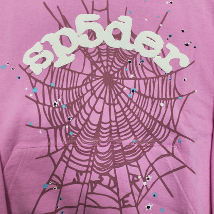 Full puff-print artwork on Sp5der OG Web Hoodie Pink with white logo, spider web and scattered stars
Close-up of raised white Sp5der lettering and star print details on the pink OG Web Hoodie
Side angle showing the raised three-dimensional puff-print texture on Sp5der OG Web Hoodie Pink