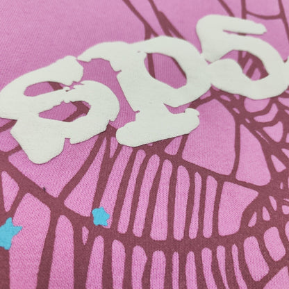 Full puff-print artwork on Sp5der OG Web Hoodie Pink with white logo, spider web and scattered stars
Close-up of raised white Sp5der lettering and star print details on the pink OG Web Hoodie
Side angle showing the raised three-dimensional puff-print texture on Sp5der OG Web Hoodie Pink