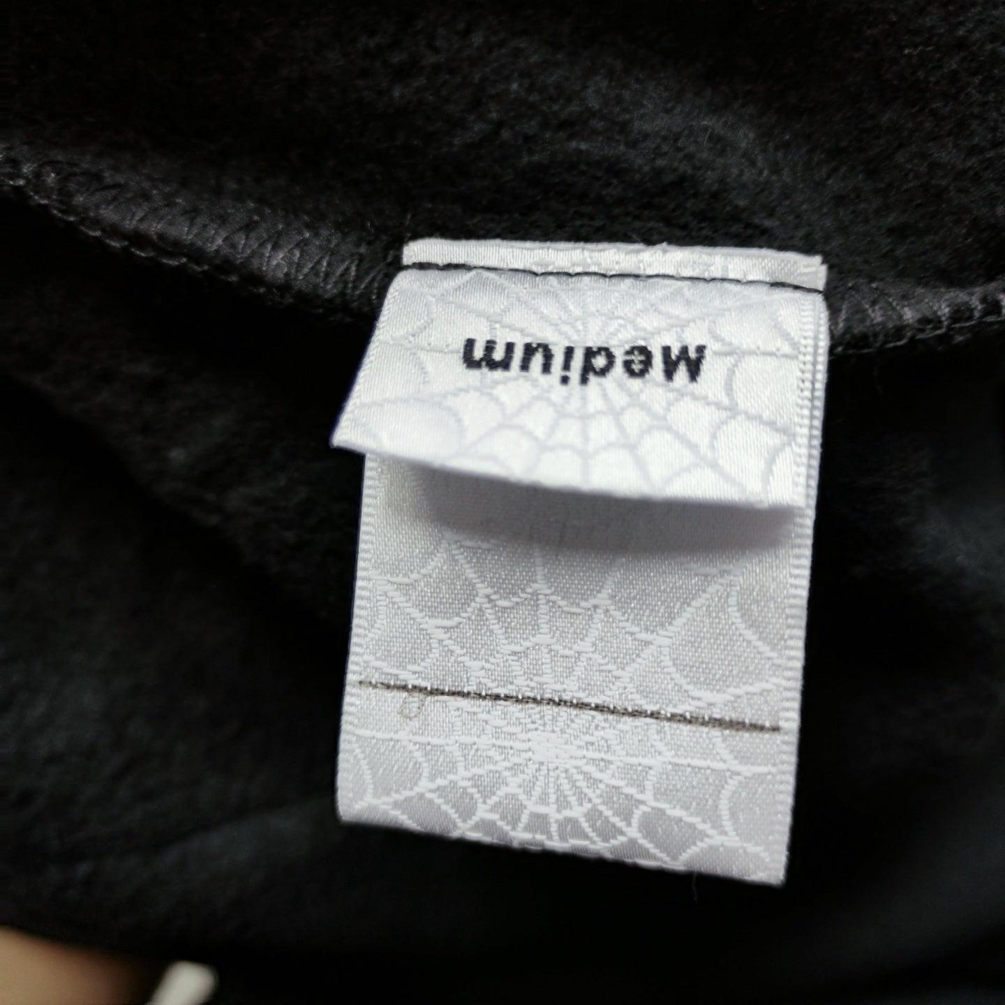 Sp5der OG Web Hoodie Black neck label and size tag detail