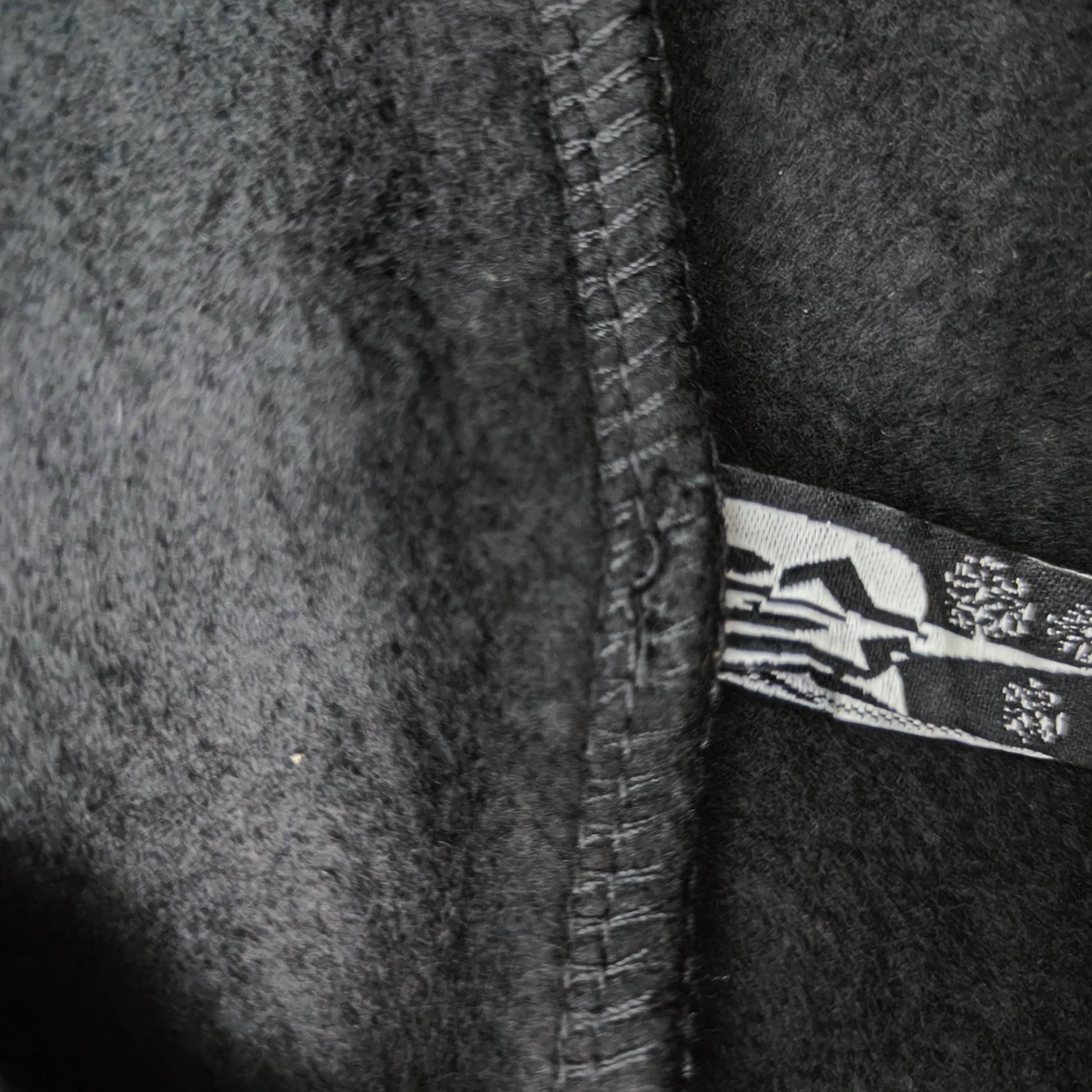 Sp5der P*NK Hoodie Black care label and washing instruction detail