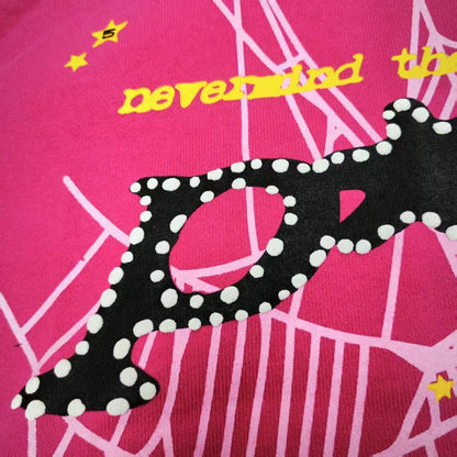 Full graphic artwork on Sp5der P*NK Hoodie Pink with black logo, white web and colorful stars
Close-up of black P*NK lettering with white dot trim on Sp5der Pink Hoodie
Side angle showing the raised three-dimensional graphic texture on Sp5der P*NK Hoodie Pink