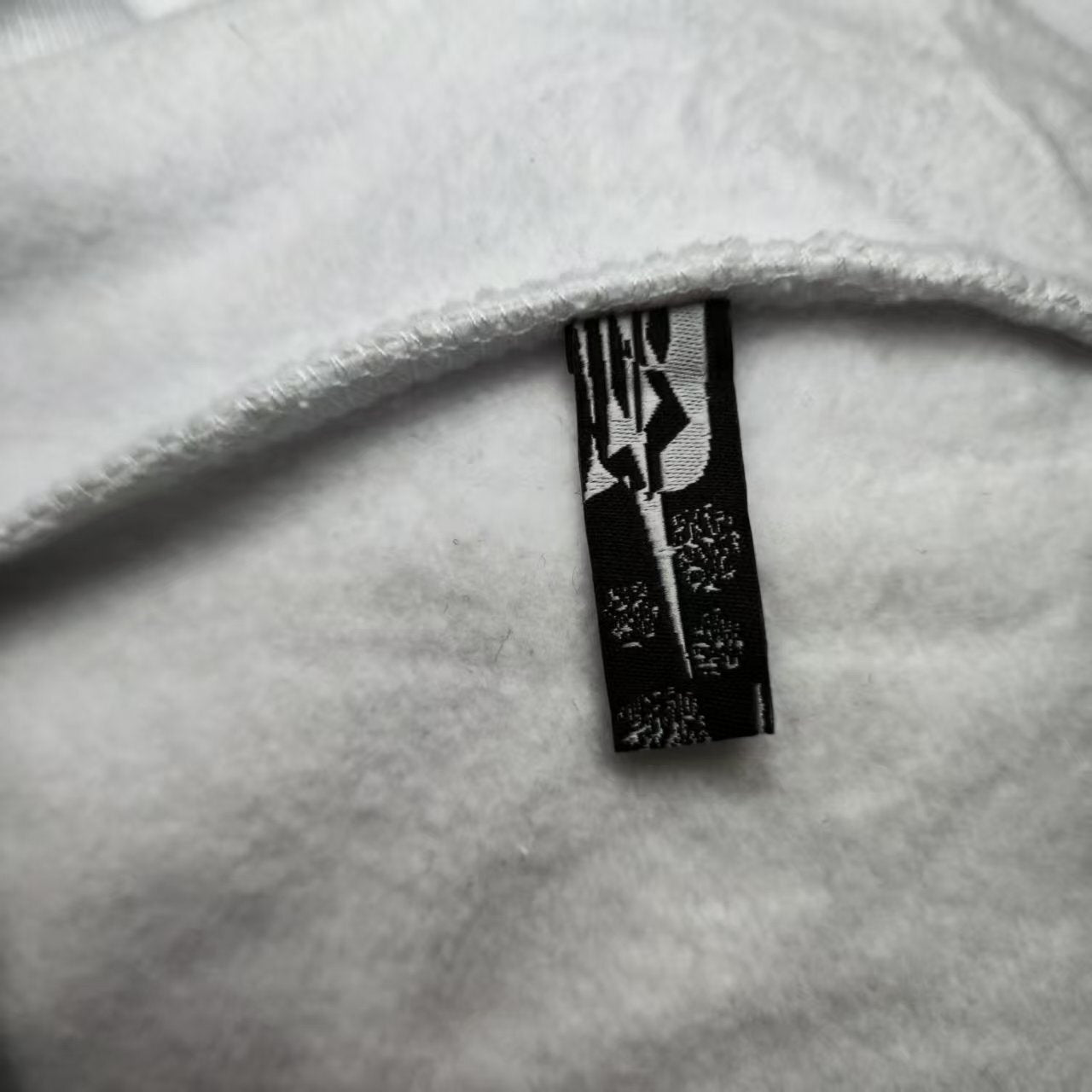 Sp5der OG Rhinestone Logo Hoodie White neck label and size tag detail
Sp5der OG Rhinestone Logo Hoodie White care label and washing instruction detail