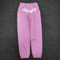 SP5DER Atlanta pink sweatpants front view with white logo and scattered star graphics