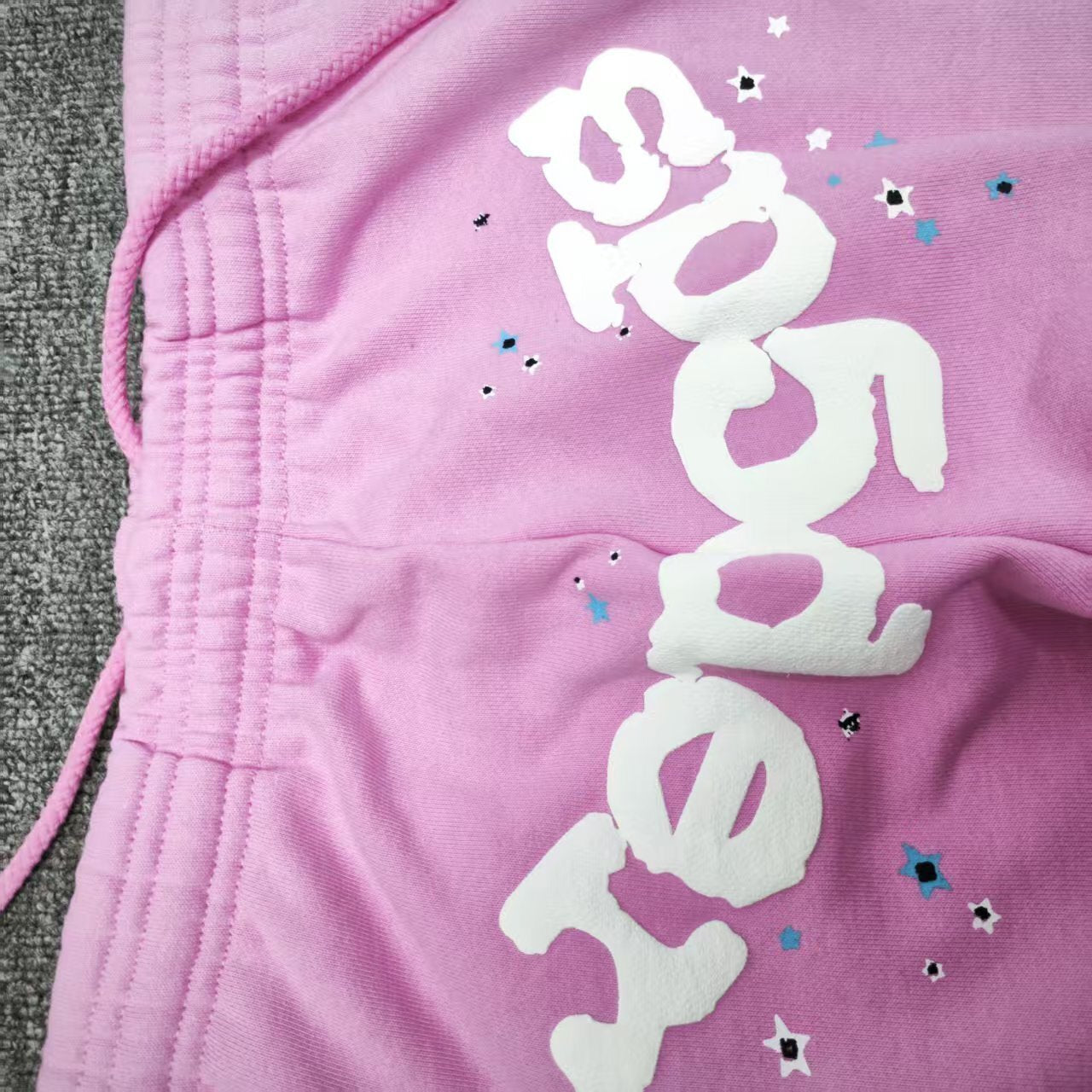Adjustable pink drawstring waist detail on SP5DER Atlanta sweatpants