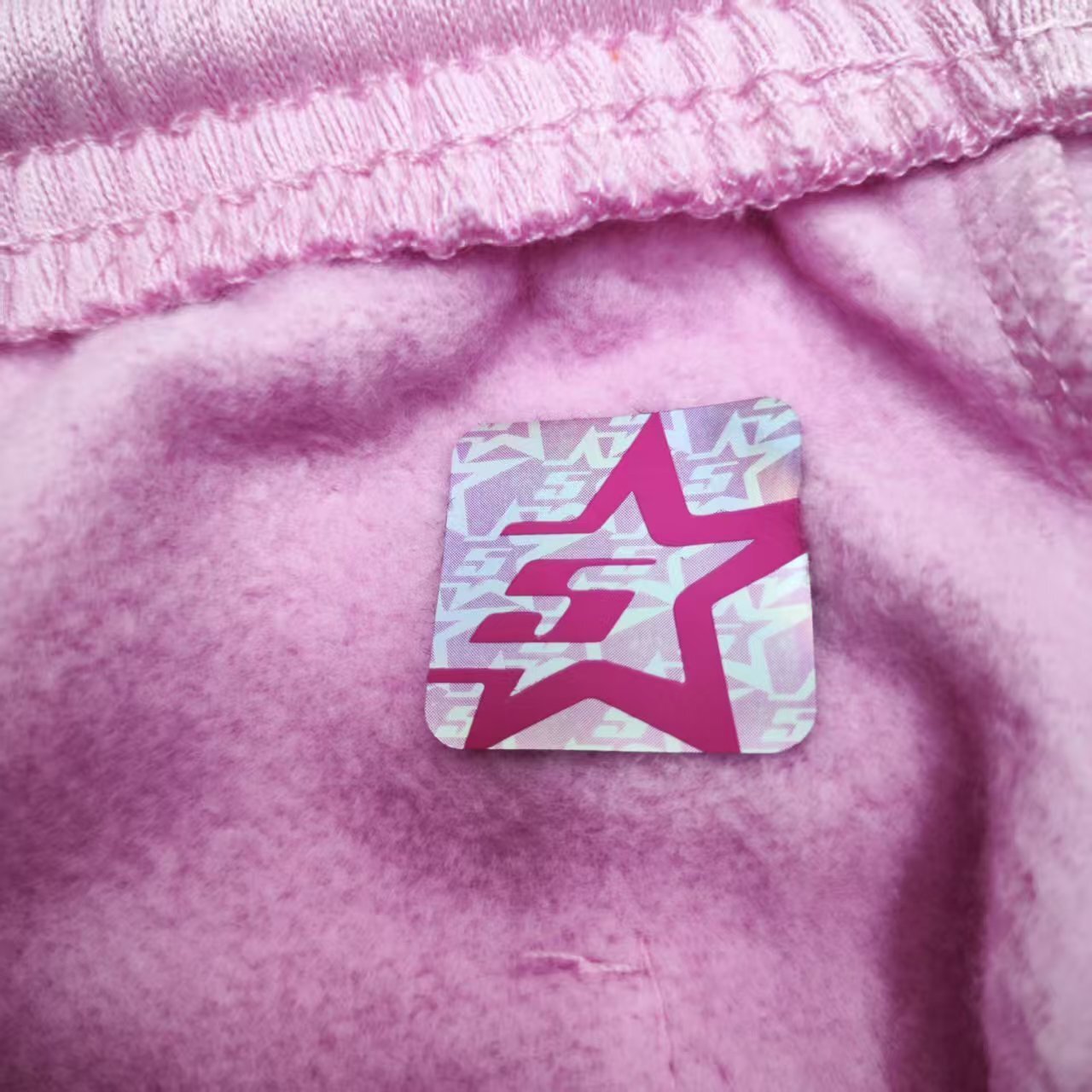 SP5DER Atlanta pink sweatpants inner waistband label detail