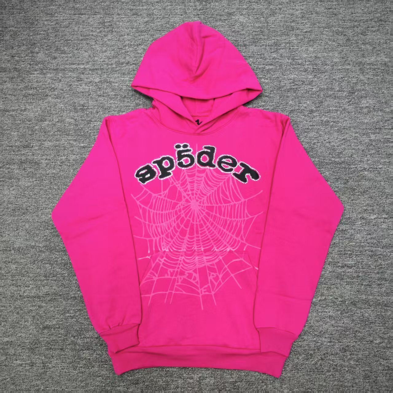 Sp5der Legacy Hoodie Pink White front view with black puff logo, rhinestone trim and tonal web graphic