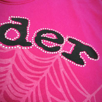 Full front artwork on Sp5der Legacy Hoodie Pink White with puff lettering, rhinestones and spider web
Close-up of raised black SP5DER puff-print lettering on the pink Legacy Hoodie
Close-up of rhinestone trim surrounding the black SP5DER lettering on the pink Legacy Hoodie
Side angle showing raised puff lettering and three-dimensional rhinestone details on Sp5der Legacy Hoodie