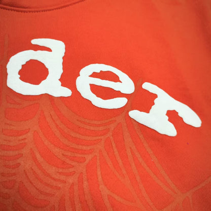 Full front artwork on Sp5der Orange Hoodie with raised white logo and tonal spider-web graphic
Close-up of raised white Sp5der lettering on the Orange Logo Hoodie Sweatshirt
Side angle showing the raised three-dimensional white logo detail on Sp5der Orange Hoodie
Close-up of tonal spider-web artwork printed across the front of Sp5der Orange Hoodie