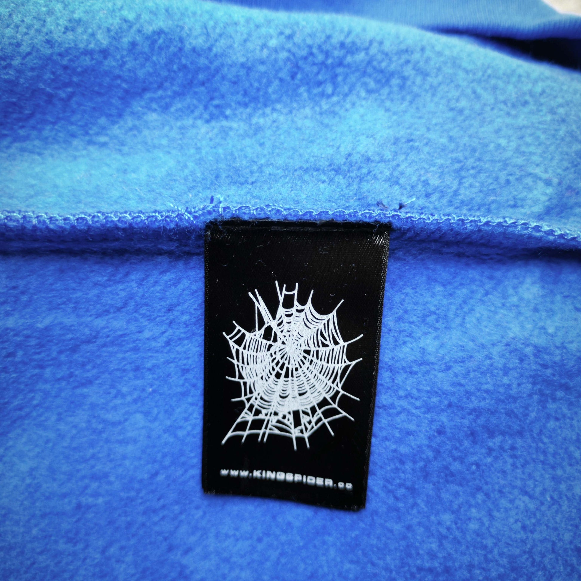 Sp5der Logo Hoodie Blue neck label and size tag detail
Sp5der Logo Hoodie Blue care label and washing instruction detail