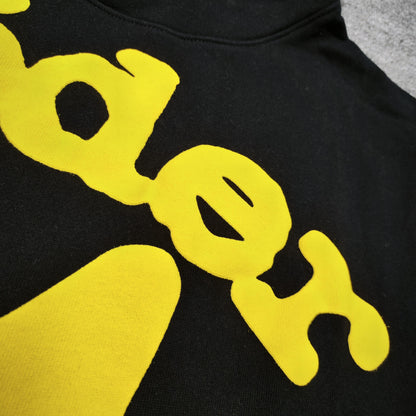 Full yellow puff-print artwork on Sp5der Beluga Hoodie Onyx Yellow with logo and star graphics
Close-up of raised yellow Sp5der lettering and smooth puff-print edges on the black Beluga Hoodie
Side angle showing the three-dimensional yellow puff-print texture on Sp5der Beluga Hoodie
Yellow star and number graphics printed across the sleeve of Sp5der Beluga Hoodie Onyx Yellow