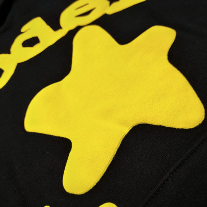 Full yellow puff-print artwork on Sp5der Beluga Hoodie Onyx Yellow with logo and star graphics
Close-up of raised yellow Sp5der lettering and smooth puff-print edges on the black Beluga Hoodie
Side angle showing the three-dimensional yellow puff-print texture on Sp5der Beluga Hoodie
Yellow star and number graphics printed across the sleeve of Sp5der Beluga Hoodie Onyx Yellow