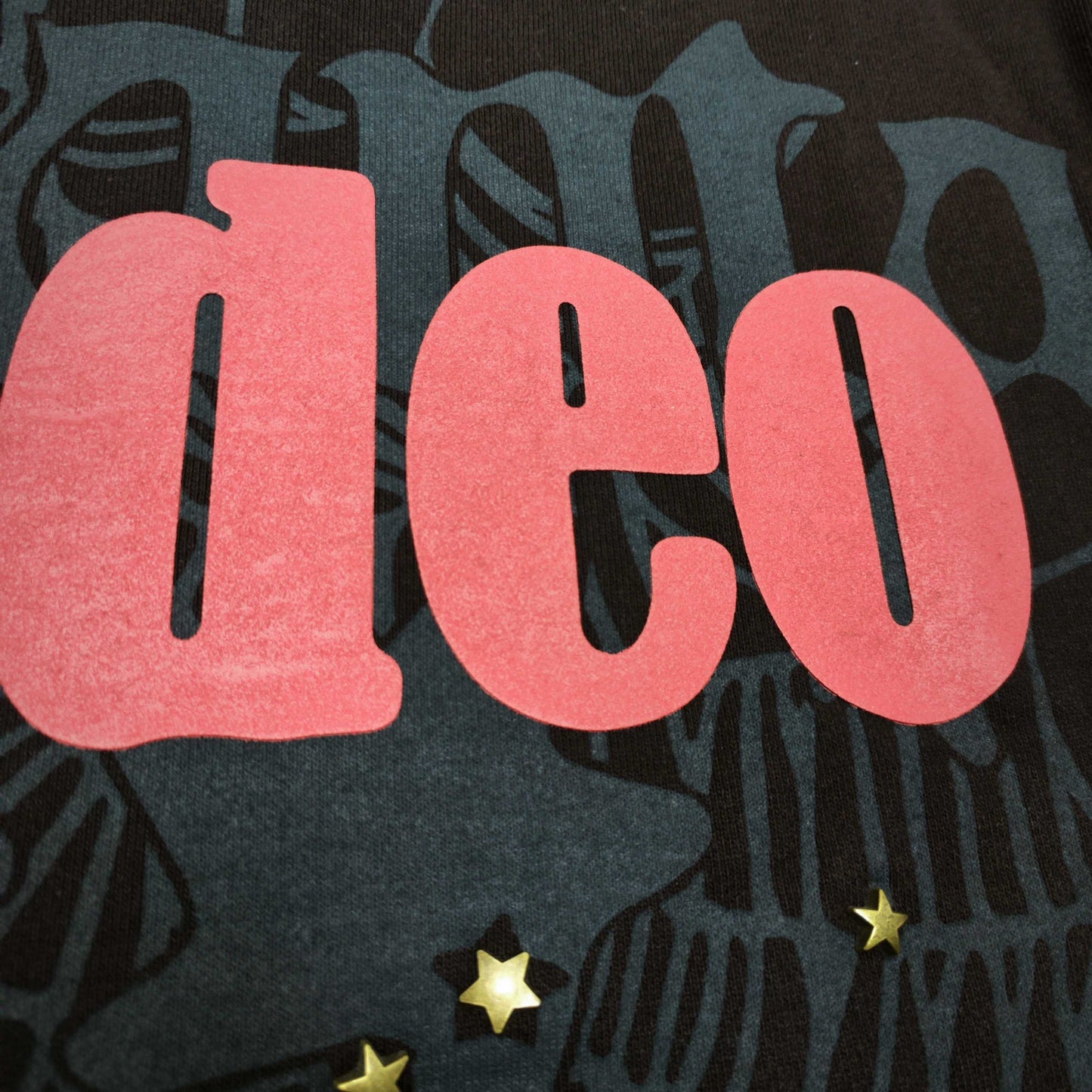 Full raised graphic on Days Before Rodeo Hoodie Brown with red RODEO lettering, ATLANTA text and spider web
Close-up of raised red RODEO lettering on Travis Scott x Sp5der brown hoodie
Side angle showing the three-dimensional raised print texture on Days Before Rodeo Hoodie Brown