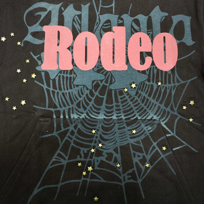 Full raised graphic on Days Before Rodeo Hoodie Brown with red RODEO lettering, ATLANTA text and spider web
Close-up of raised red RODEO lettering on Travis Scott x Sp5der brown hoodie
Side angle showing the three-dimensional raised print texture on Days Before Rodeo Hoodie Brown