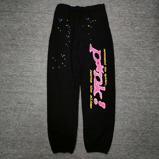 SP5DER P*NK V2 black sweatpants front view with pink leg graphic and multicolor stars