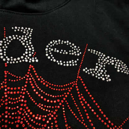 Full rhinestone artwork on Sp5der OG Web V2 Hoodie Black with silver logo and red spider web
Close-up of silver rhinestone SP5DER lettering on the black OG Web V2 Hoodie
Close-up of red rhinestone spider-web detailing on Sp5der OG Web V2 Hoodie Black
Side angle showing the raised three-dimensional rhinestone texture on Sp5der OG Web V2 Hoodie
