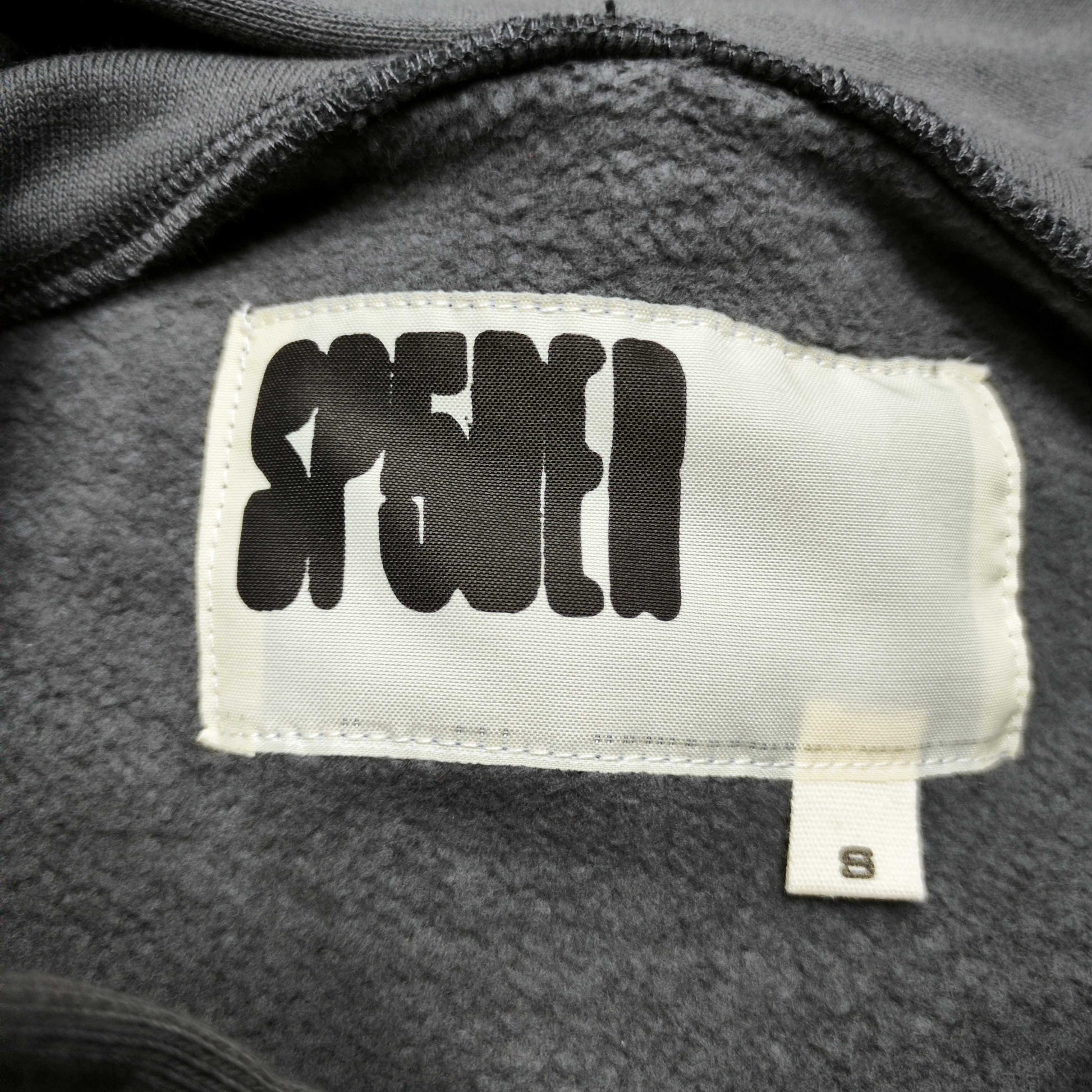 Sp5der Punk V2 Hoodie Slate Grey neck label and size tag detail
Sp5der Punk V2 Hoodie Slate Grey care label and washing instruction detail