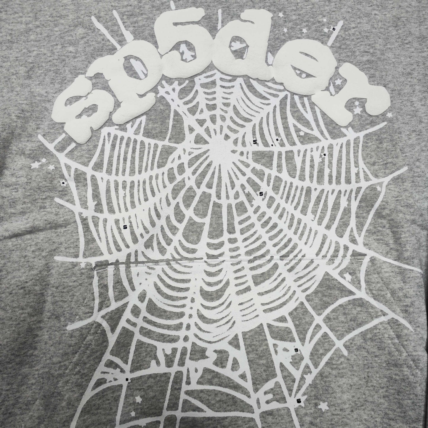 Full front artwork on Sp5der OG Web Hoodie Heather Grey with white puff logo and spider web
Full front artwork on Sp5der OG Web Hoodie Heather Grey with white puff logo and spider web
Side angle showing the three-dimensional white puff-print texture on Sp5der OG Web Hoodie
Close-up of white spider-web artwork on the front of Sp5der OG Web Hoodie Heather Grey