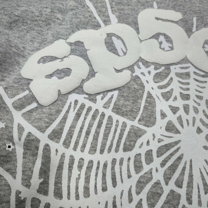 Full front artwork on Sp5der OG Web Hoodie Heather Grey with white puff logo and spider web
Full front artwork on Sp5der OG Web Hoodie Heather Grey with white puff logo and spider web
Side angle showing the three-dimensional white puff-print texture on Sp5der OG Web Hoodie
Close-up of white spider-web artwork on the front of Sp5der OG Web Hoodie Heather Grey
