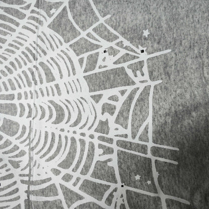 Full front artwork on Sp5der OG Web Hoodie Heather Grey with white puff logo and spider web
Full front artwork on Sp5der OG Web Hoodie Heather Grey with white puff logo and spider web
Side angle showing the three-dimensional white puff-print texture on Sp5der OG Web Hoodie
Close-up of white spider-web artwork on the front of Sp5der OG Web Hoodie Heather Grey
