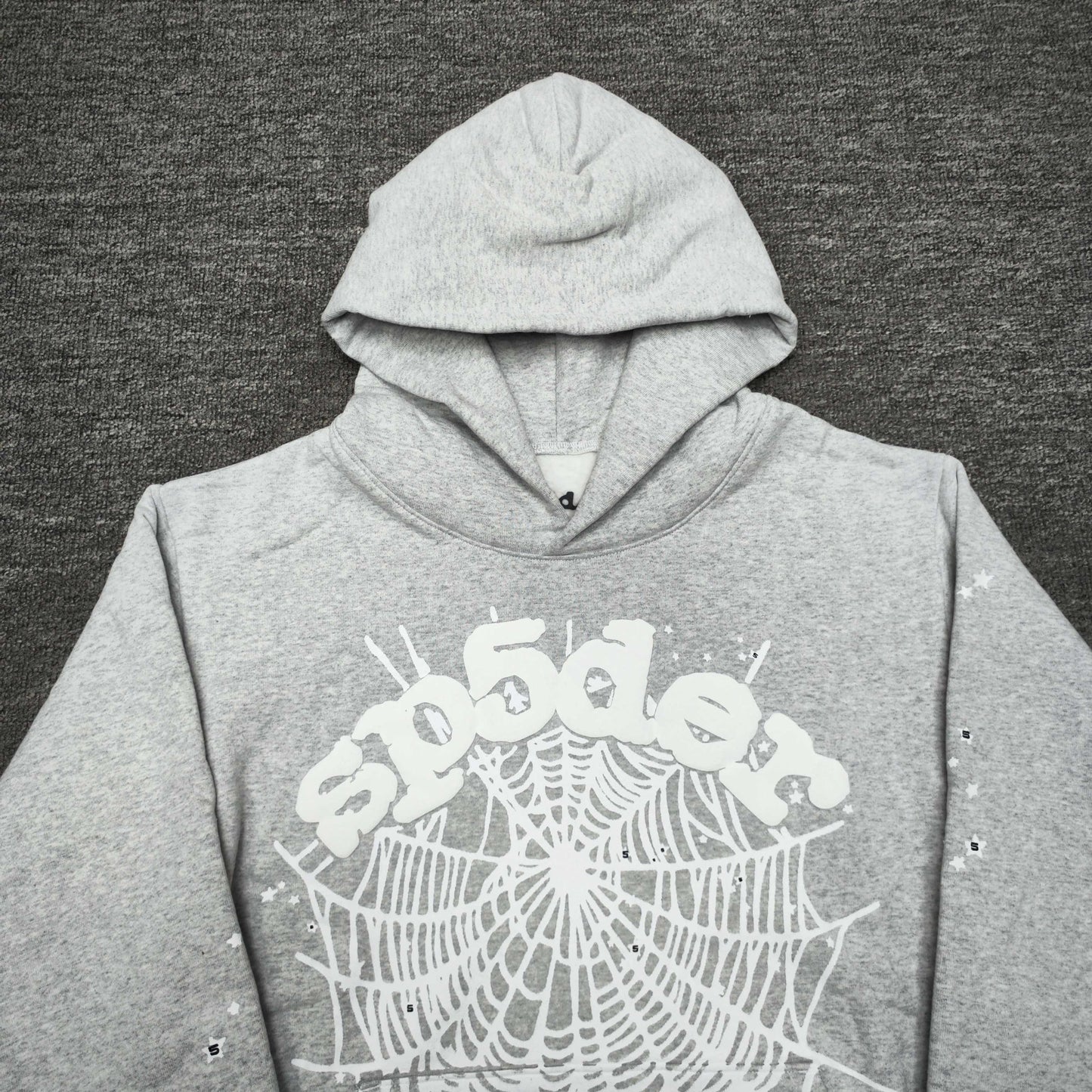 Full front artwork on Sp5der OG Web Hoodie Heather Grey with white puff logo and spider web
Full front artwork on Sp5der OG Web Hoodie Heather Grey with white puff logo and spider web
Side angle showing the three-dimensional white puff-print texture on Sp5der OG Web Hoodie
Close-up of white spider-web artwork on the front of Sp5der OG Web Hoodie Heather Grey