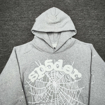 Full front artwork on Sp5der OG Web Hoodie Heather Grey with white puff logo and spider web
Full front artwork on Sp5der OG Web Hoodie Heather Grey with white puff logo and spider web
Side angle showing the three-dimensional white puff-print texture on Sp5der OG Web Hoodie
Close-up of white spider-web artwork on the front of Sp5der OG Web Hoodie Heather Grey