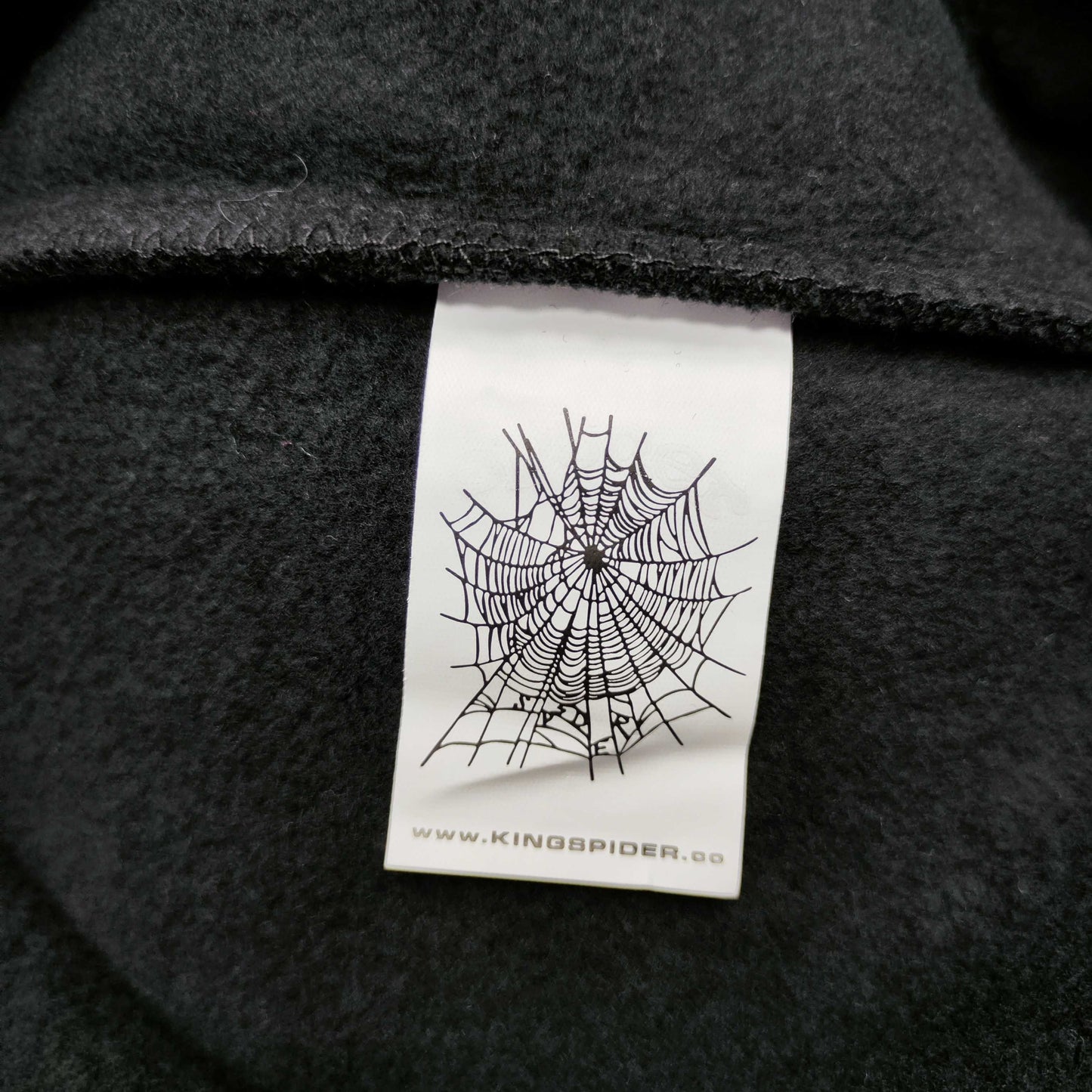 Sp5der Angel Number Hoodie Black neck label and size tag detail
Sp5der Angel Number Hoodie Black care label and washing instruction detail