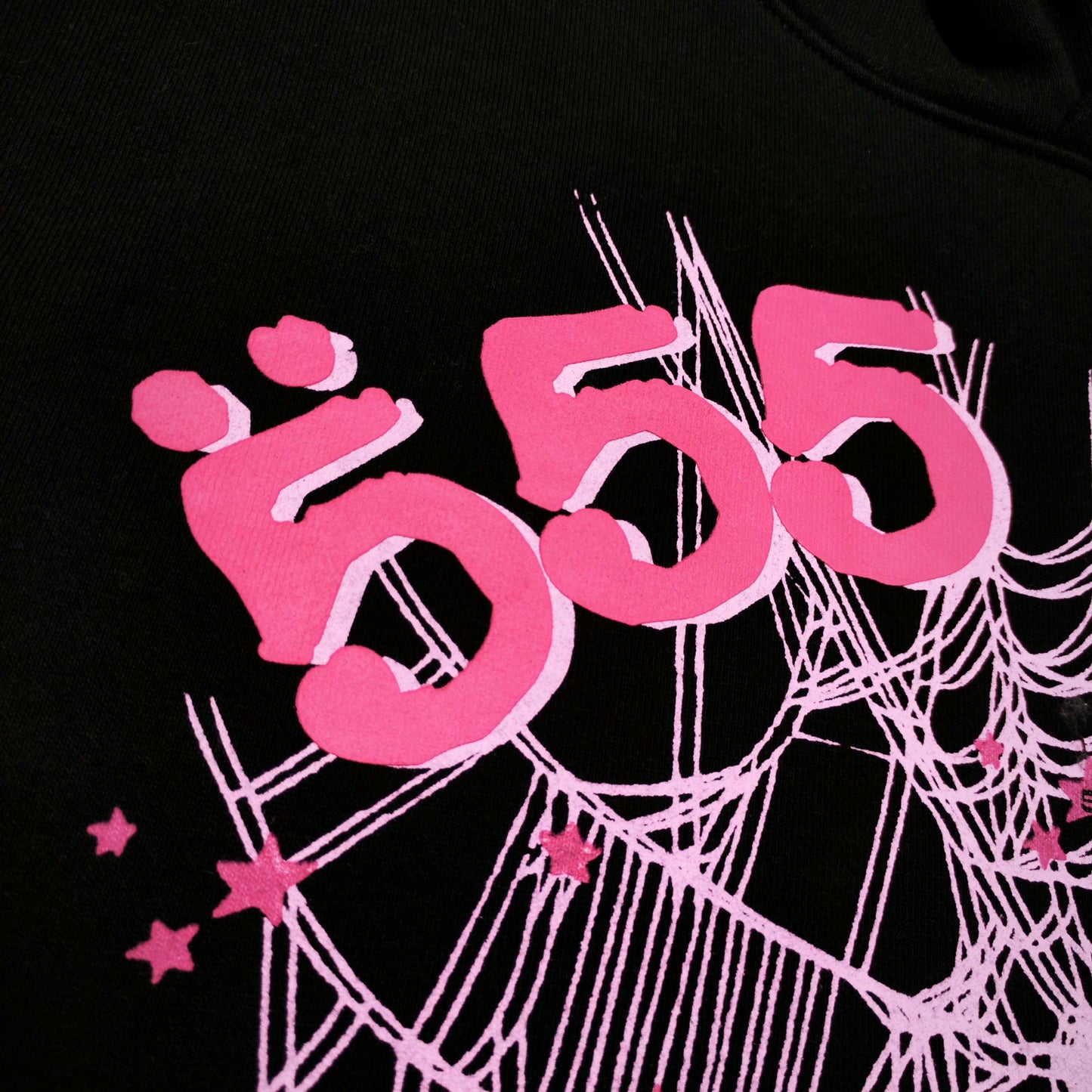 Full front artwork on Sp5der Angel Number Hoodie Black with pink 555 puff print and spider web
Close-up of raised pink 555 puff-print lettering on Sp5der Angel Number Hoodie Black
Side angle showing the three-dimensional pink puff-print texture on Sp5der Angel Number Hoodie
Close-up of pink OG spider-web artwork on Sp5der Angel Number Hoodie Black