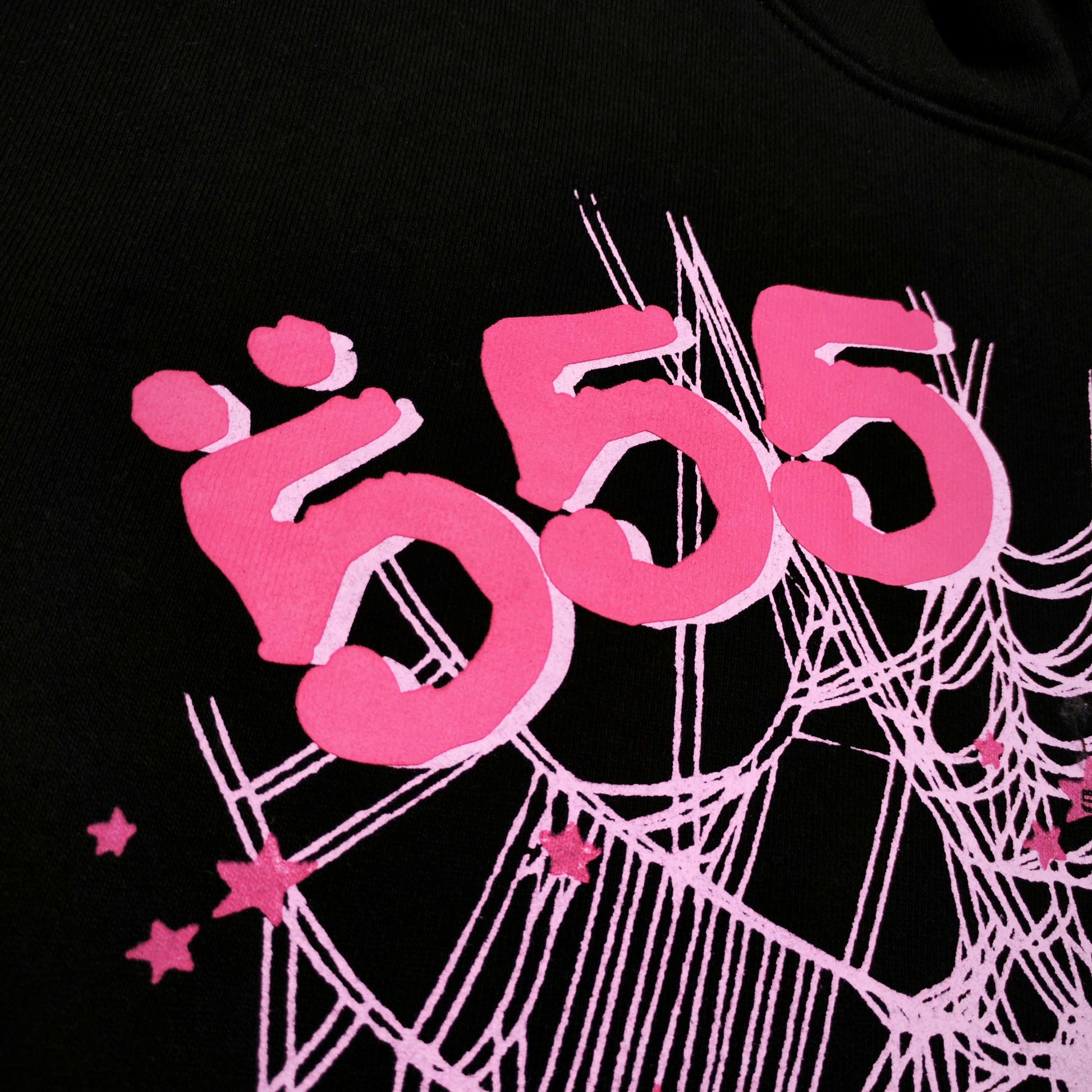 Full front artwork on Sp5der Angel Number Hoodie Black with pink 555 puff print and spider web
Close-up of raised pink 555 puff-print lettering on Sp5der Angel Number Hoodie Black
Side angle showing the three-dimensional pink puff-print texture on Sp5der Angel Number Hoodie
Close-up of pink OG spider-web artwork on Sp5der Angel Number Hoodie Black