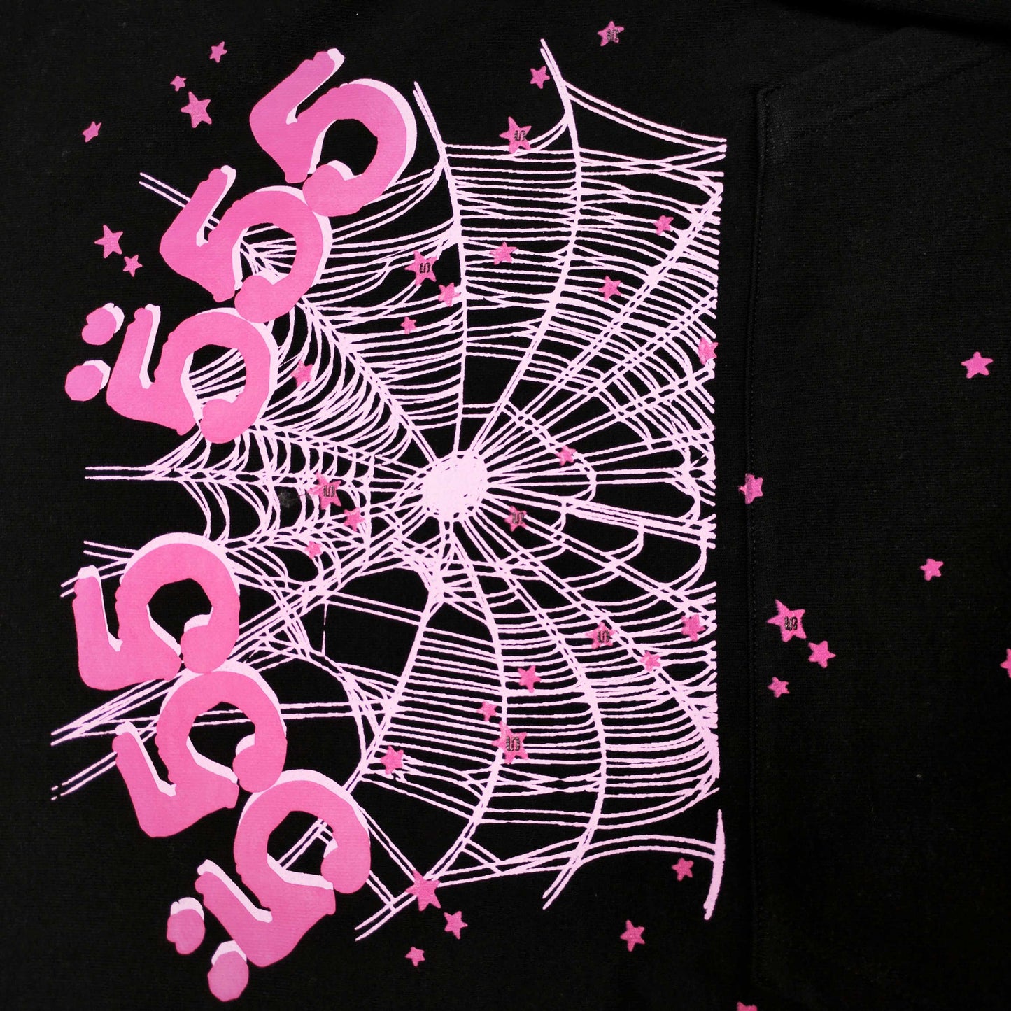 Full front artwork on Sp5der Angel Number Hoodie Black with pink 555 puff print and spider web
Close-up of raised pink 555 puff-print lettering on Sp5der Angel Number Hoodie Black
Side angle showing the three-dimensional pink puff-print texture on Sp5der Angel Number Hoodie
Close-up of pink OG spider-web artwork on Sp5der Angel Number Hoodie Black