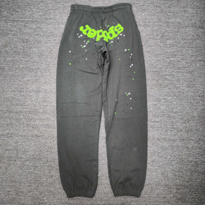 SP5DER Wait Web slate grey sweatpants front view with neon green logo and scattered stars