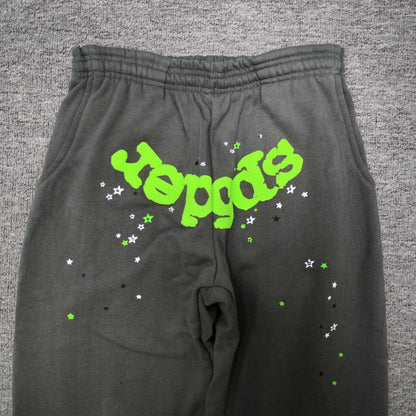 Neon green SP5DER logo and scattered star graphics on slate grey Wait Web sweatpants