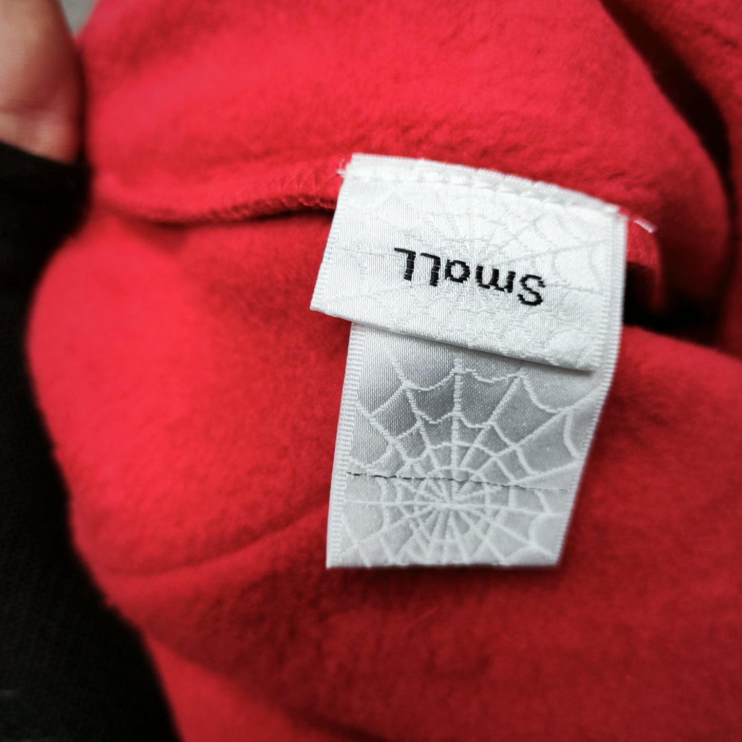 Sp5der Beluga Hoodie Red Black neck label and size tag detail
Sp5der Beluga Hoodie Red Black care label and washing instruction detail