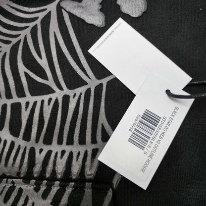 Full front artwork on Sp5der OG Web Hoodie Black with raised grey logo and tonal spider web
Close-up of raised dark-grey SP5DER lettering on the black OG Web Hoodie
Side angle showing the three-dimensional raised logo texture on Sp5der OG Web Hoodie Black
Close-up of tonal dark-grey spider-web artwork on Sp5der OG Web Hoodie Black
Close-up of tonal web graphic alignment around the kangaroo pocket on Sp5der black hoodie