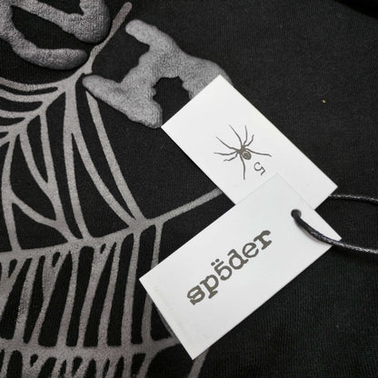 Sp5der OG Web Hoodie Black neck label and size tag detail
Sp5der OG Web Hoodie Black care label and washing instruction detail