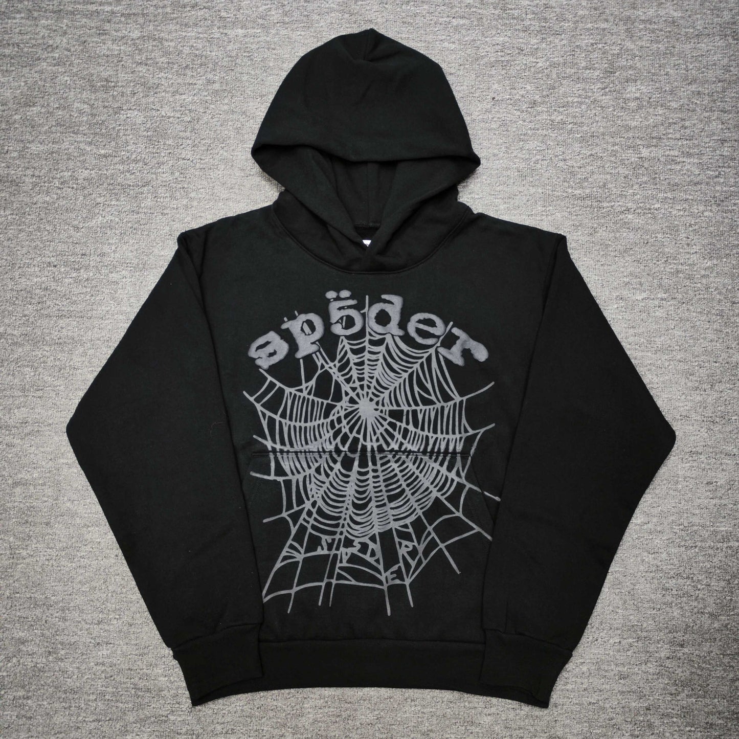 Sp5der OG Web Hoodie Black front view with raised dark-grey logo and tonal spider-web graphic